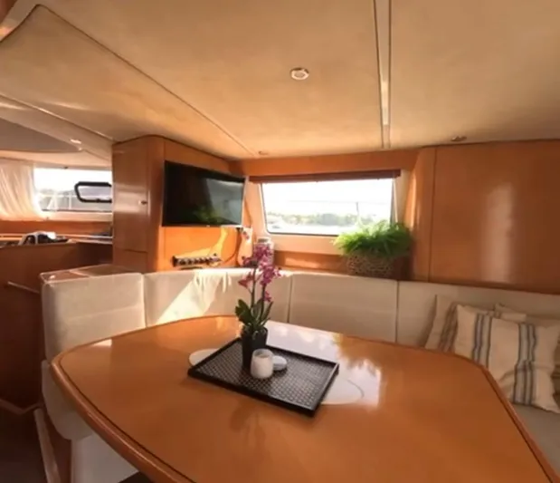 Kishta Yacht Photos Pics Luxurious interior of 2009 Fountaine Pajot Cumberland 46 yacht with elegant dining area.