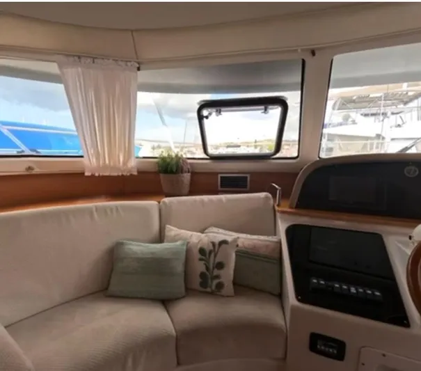 Kishta Yacht Photos Pics Interior of 2009 Fountaine Pajot Cumberland 46 yacht with cozy seating and cushions.