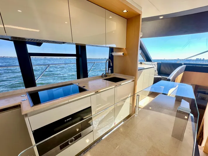  Yacht Photos Pics Luxurious kitchen interior on a 2016 Absolute 72 FLY yacht with ocean view.