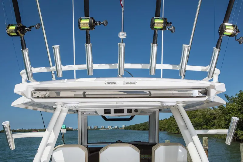  Yacht Photos Pics Manufacturer Provided Image: 2019 Pursuit S 368 Sport boat with fishing rods and blue sky background.