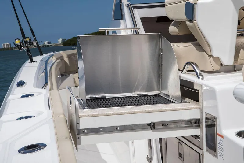  Yacht Photos Pics Manufacturer Provided Image: 2020 Pursuit S 368 Sport boat with built-in grill and fishing rod holders.