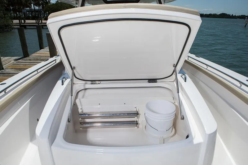  Yacht Photos Pics Manufacturer Provided Image: 2020 Pursuit S 368 Sport boat storage compartment open by the dock.