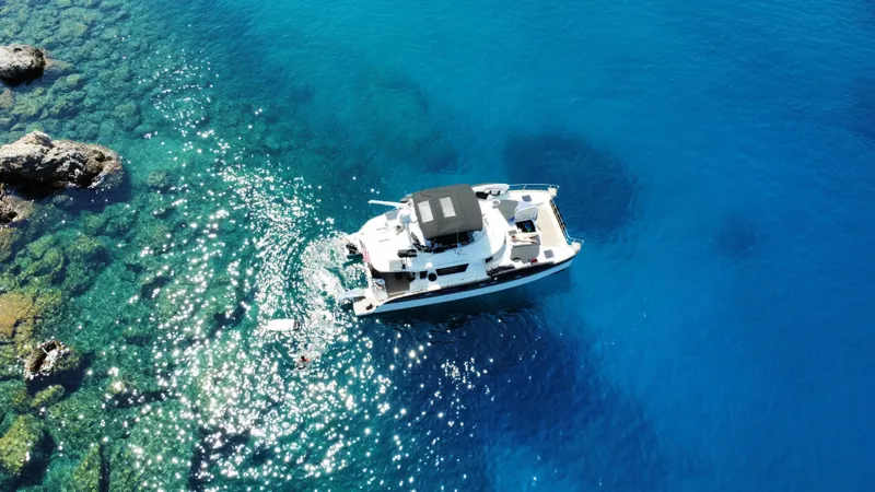 Kishta Yacht Photos Pics Aerial view of 2009 Fountaine Pajot Cumberland 46 yacht on clear blue water.