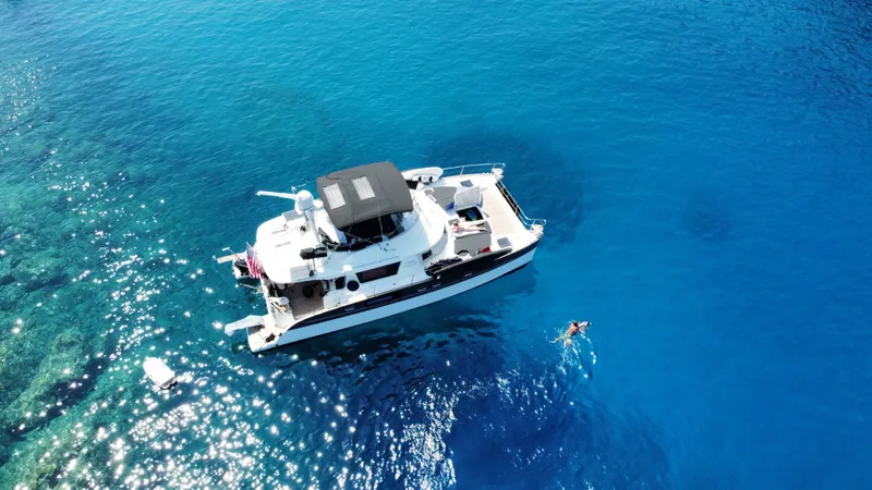Kishta Yacht Photos Pics Aerial view of 2009 Fountaine Pajot Cumberland 46 yacht on clear blue water.