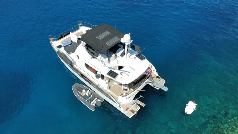 Kishta Yacht Photos Pics Aerial view of 2009 Fountaine Pajot Cumberland 46 yacht on clear blue water.