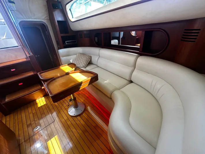  Yacht Photos Pics Luxurious interior of 2006 Chris-Craft 43 Roamer yacht with elegant seating and wooden accents.