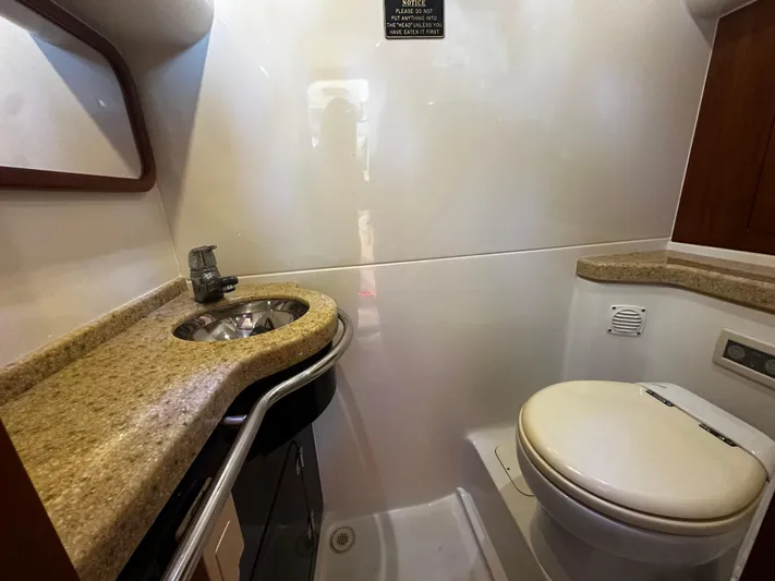  Yacht Photos Pics Luxurious bathroom in 2006 Chris-Craft 43 Roamer yacht with sink and toilet.