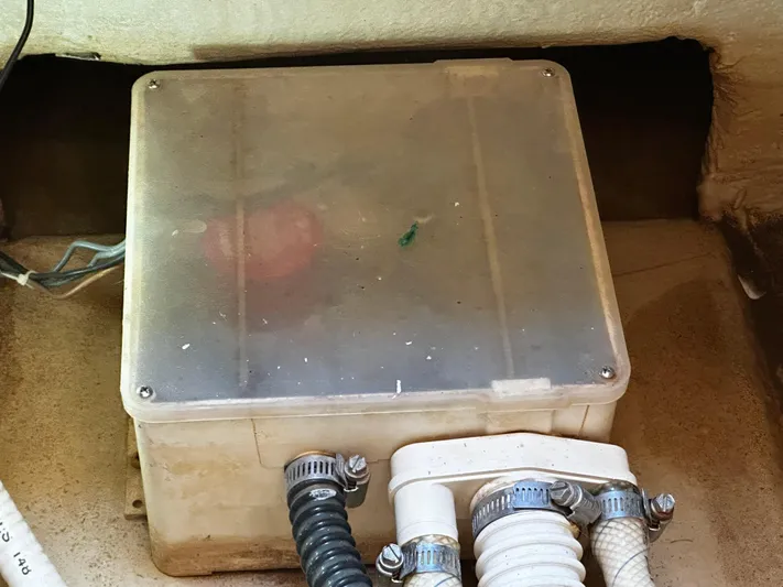  Yacht Photos Pics Electrical box in 2006 Chris-Craft 43 Roamer boat, featuring hoses and wiring.