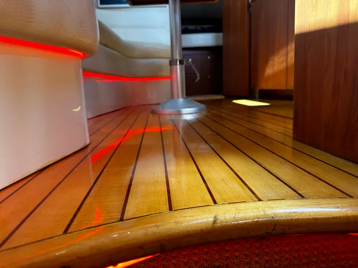  Yacht Photos Pics Luxurious interior of 2006 Chris-Craft 43 Roamer with polished wooden flooring and ambient lighting.