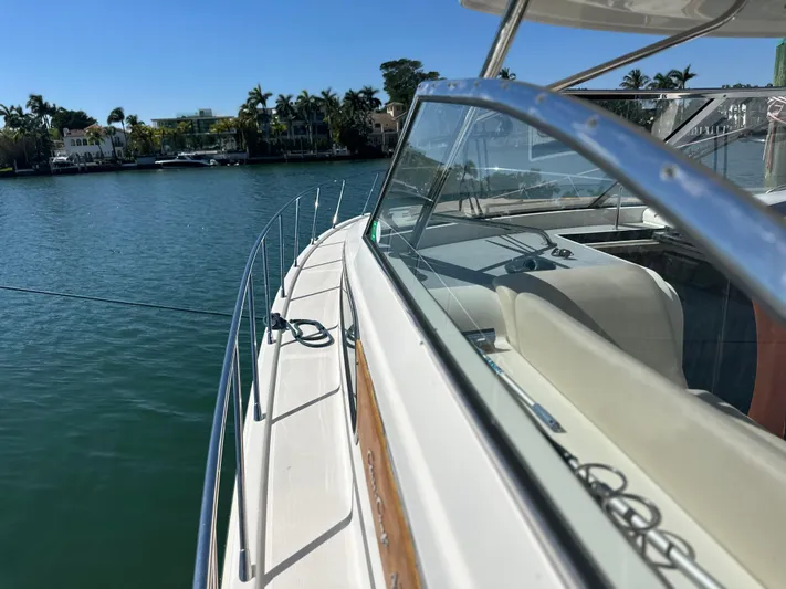  Yacht Photos Pics 2006 Chris-Craft 43 Roamer yacht on calm water, showcasing sleek design and luxurious seating.