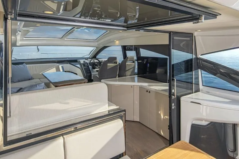  Yacht Photos Pics Interior of 2021 Fairline Targa 45 GT yacht with modern seating and panoramic windows.