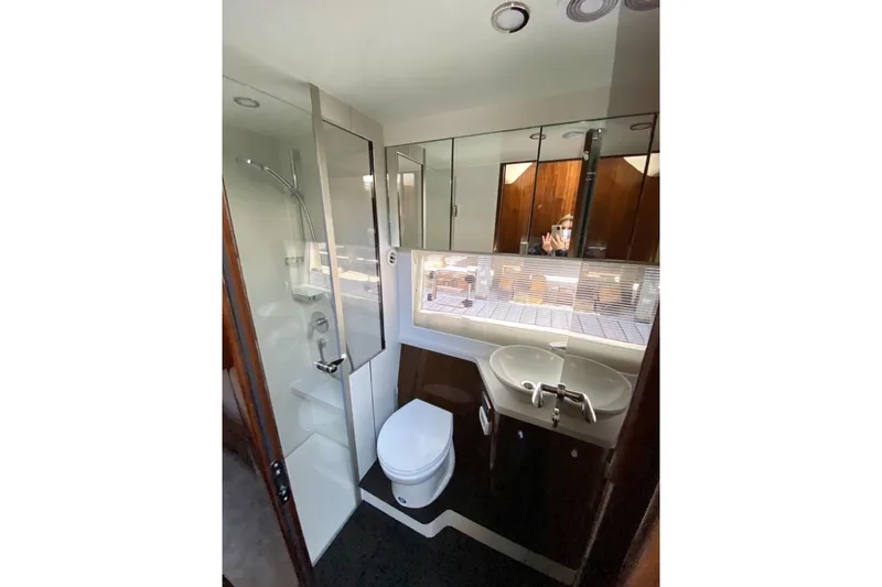  Yacht Photos Pics Luxurious bathroom in 2021 Fairline Targa 45 GT yacht with modern fixtures.