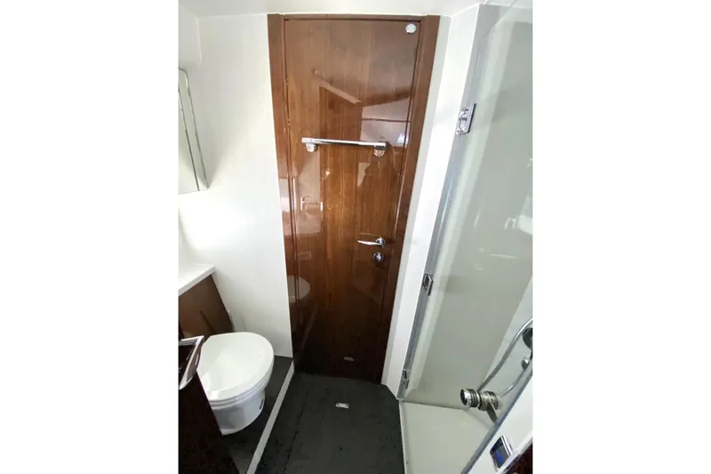  Yacht Photos Pics Luxurious bathroom in 2021 Fairline Targa 45 GT yacht with modern fixtures.