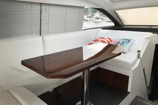  Yacht Photos Pics Interior of 2021 Fairline Targa 45 GT yacht with sleek table and white seating.