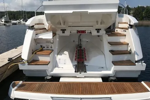  Yacht Photos Pics 2021 Fairline Targa 45 GT yacht with open engine compartment at marina.