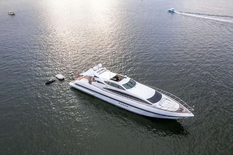Daya Yacht Photos Pics Luxury 2007 Mangusta 105 yacht on calm water, aerial view.