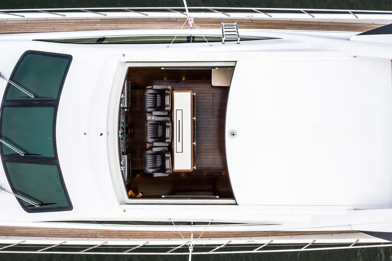 Daya Yacht Photos Pics Overhead view of 2007 Mangusta 105 yacht's sleek deck and seating area.