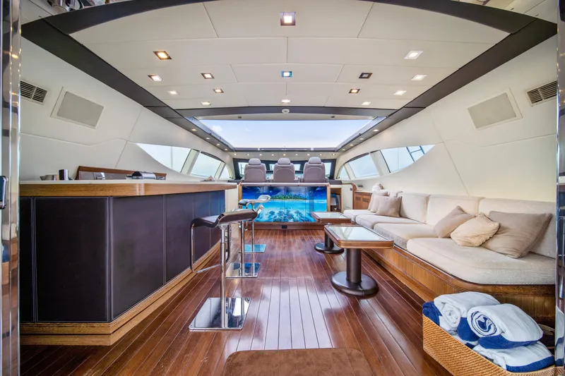 Daya Yacht Photos Pics Luxurious interior of 2007 Mangusta 105 yacht with modern seating and elegant design.