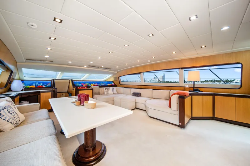 Daya Yacht Photos Pics Luxurious interior of 2007 Mangusta 105 yacht with elegant seating and panoramic windows.