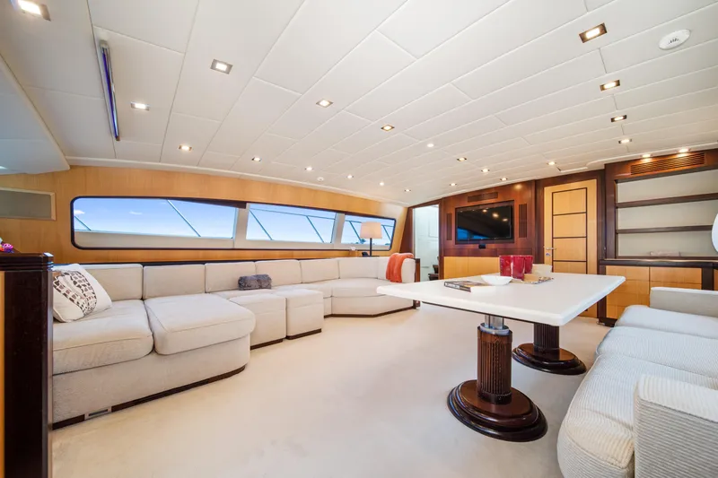 Daya Yacht Photos Pics Luxurious interior of 2007 Mangusta 105 yacht with elegant seating and modern decor.