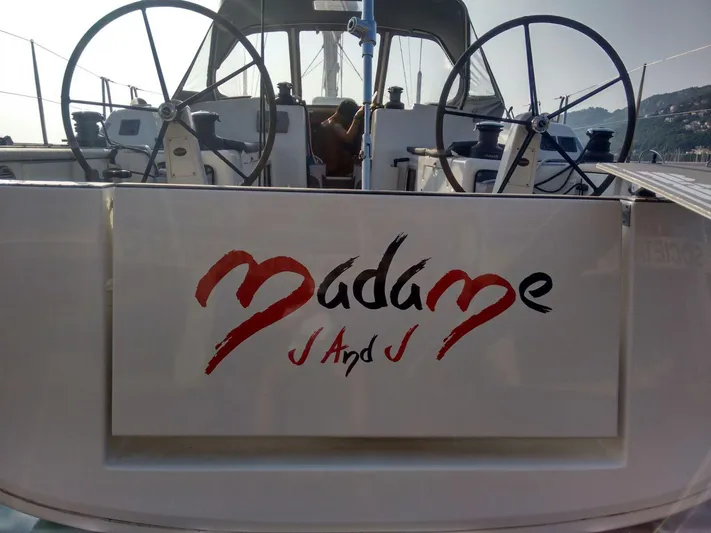  Yacht Photos Pics Dufour 45E Performance 2010 yacht with dual steering wheels and "Madame J and J" signage.