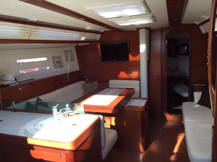  Yacht Photos Pics Interior of 2010 Dufour 45E Performance yacht, featuring elegant wood finish and modern amenities.