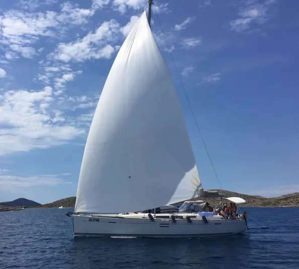  Yacht Photos Pics Sailing yacht Dufour 45E Performance 2010 on open water under clear skies.