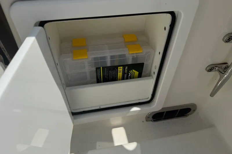  Yacht Photos Pics Storage compartment on a 2018 Regulator 31 boat with a tackle box inside.