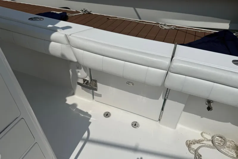  Yacht Photos Pics 2018 Regulator 31 boat interior with white cushioned seating and deck ropes.