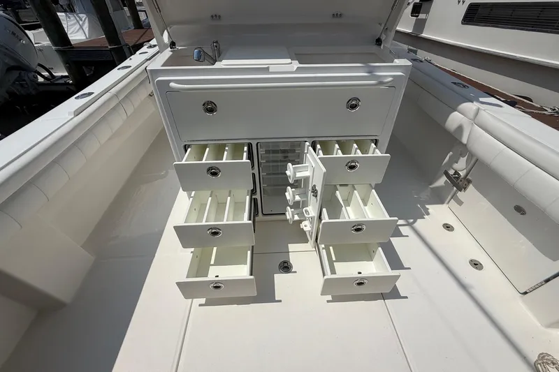  Yacht Photos Pics 2018 Regulator 31 boat with open storage compartments and drawers.