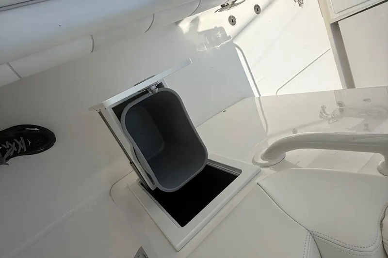  Yacht Photos Pics 2018 Regulator 31 boat interior with built-in storage compartment and seating area.