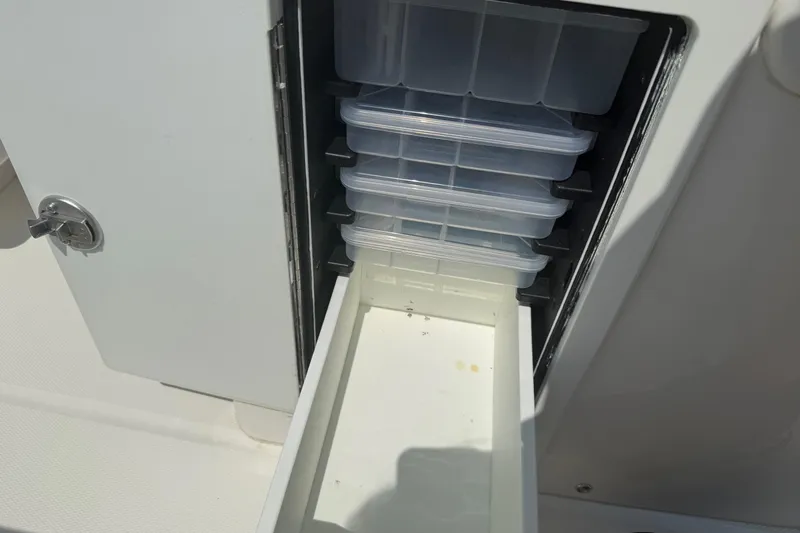  Yacht Photos Pics Storage compartment with tackle boxes on a 2018 Regulator 31 boat.