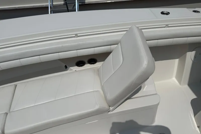  Yacht Photos Pics 2018 Regulator 31 boat with white cushioned seating and sleek design.