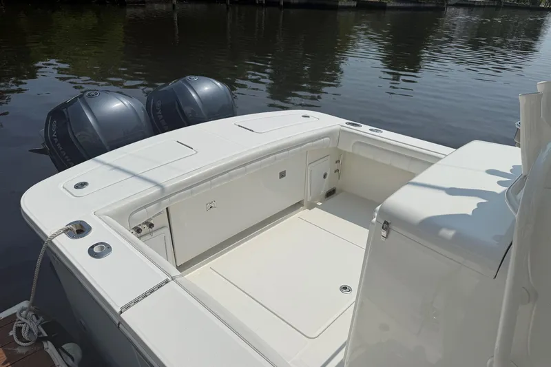  Yacht Photos Pics 2018 Regulator 31 boat with twin Yamaha outboard engines on calm water.