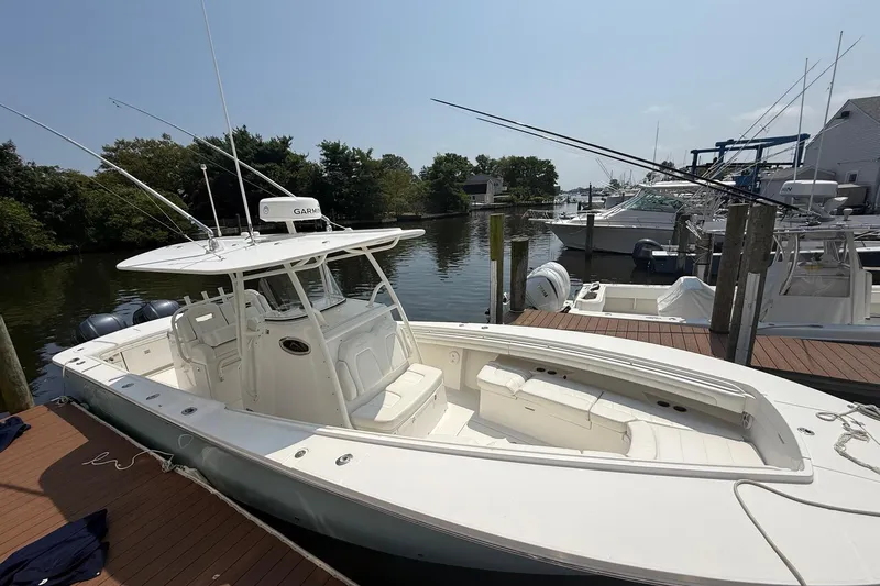  Yacht Photos Pics 2018 Regulator 31 boat docked, featuring spacious deck and advanced navigation equipment.