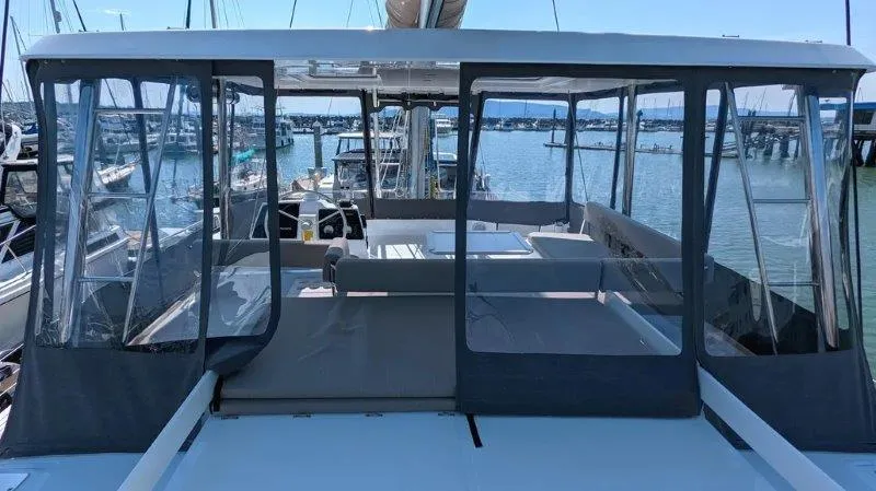 Neve Yacht Photos Pics 2022 Bali 4.6 yacht with enclosed deck, docked at marina.