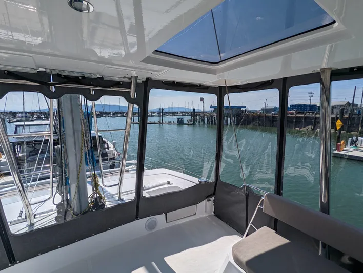 Neve Yacht Photos Pics Interior view of 2022 Bali 4.6 yacht with marina backdrop.