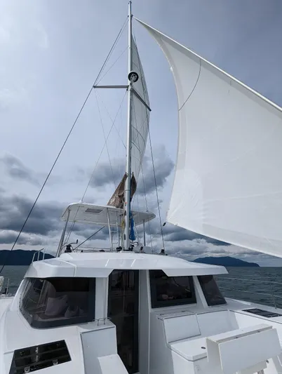 Neve Yacht Photos Pics 2022 Bali 4.6 yacht sailing under cloudy skies with full sails.