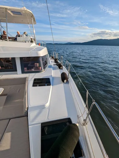 Neve Yacht Photos Pics 2022 Bali 4.6 yacht sailing on calm waters under a clear blue sky.