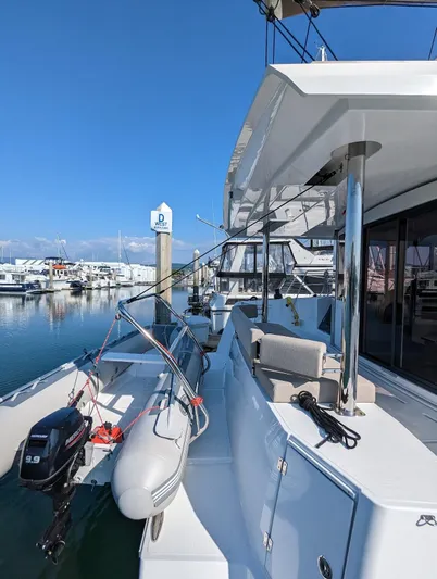 Neve Yacht Photos Pics 2022 Bali 4.6 yacht docked at marina with inflatable boat.