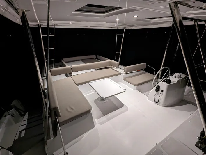 Neve Yacht Photos Pics Spacious interior of 2022 Bali 4.6 catamaran with seating and helm station.