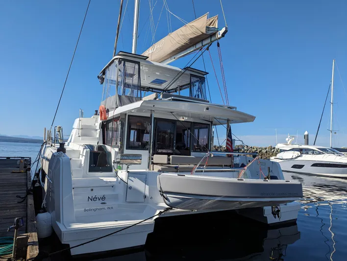 Neve Yacht Photos Pics 2022 Bali 4.6 catamaran docked at marina under clear blue sky.
