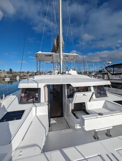 Neve Yacht Photos Pics 2022 Bali 4.6 catamaran docked at marina under clear blue sky.