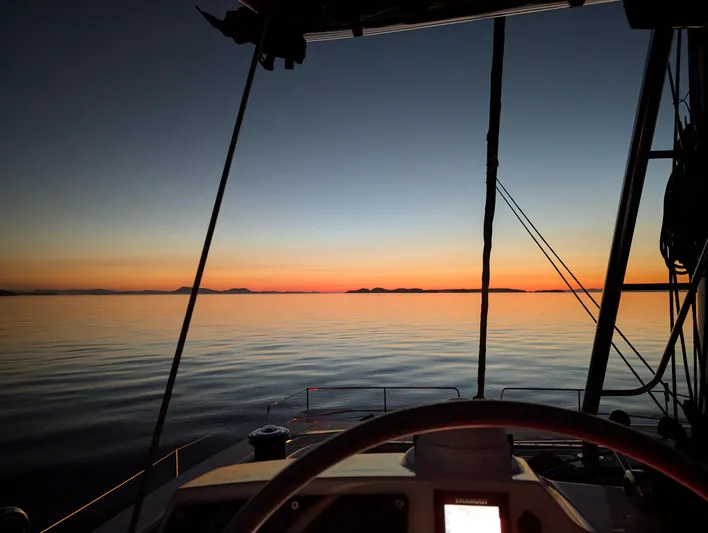 Neve Yacht Photos Pics Sunset view from a 2022 Bali 4.6 yacht, calm sea and vibrant horizon.