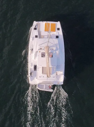 Neve Yacht Photos Pics Aerial view of 2022 Bali 4.6 catamaran sailing on open water.
