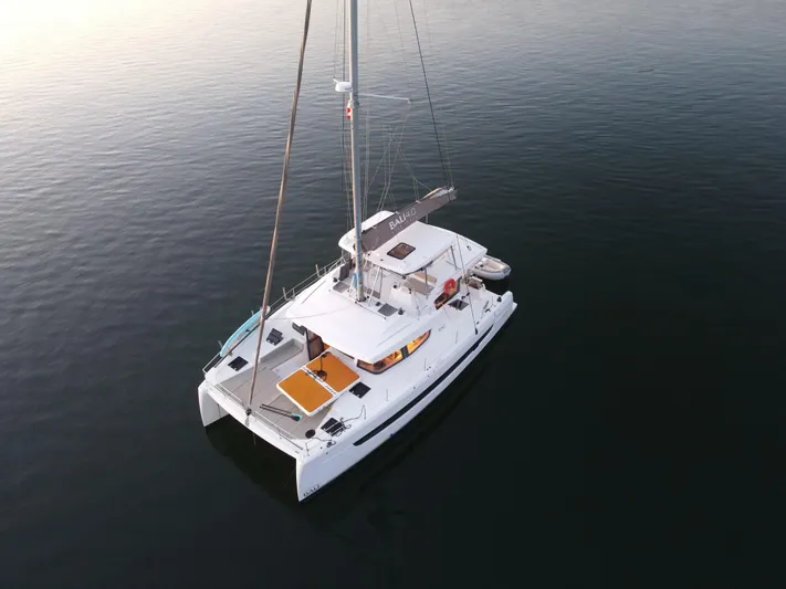 Neve Yacht Photos Pics Aerial view of 2022 Bali 4.6 catamaran sailing on calm water.