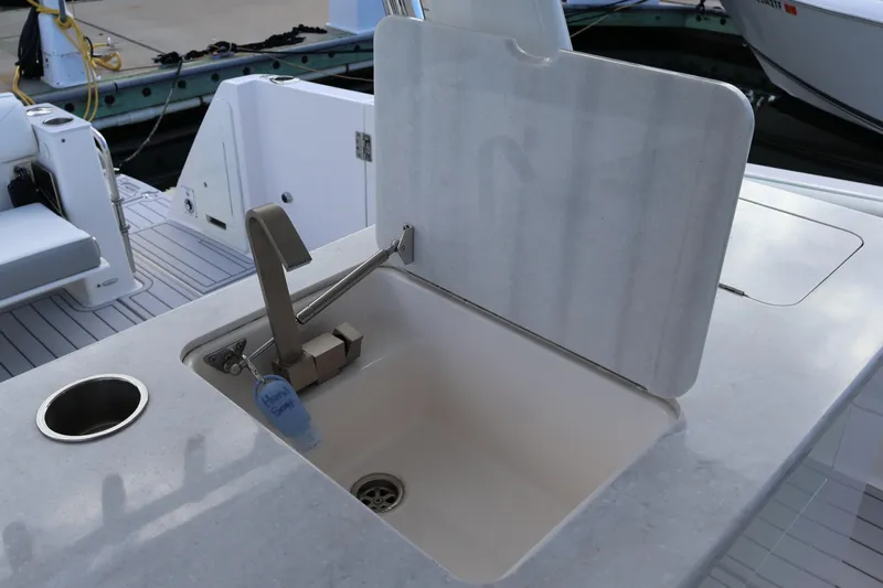  Yacht Photos Pics 2022 Regal 38 SAV boat sink with faucet and countertop detail.