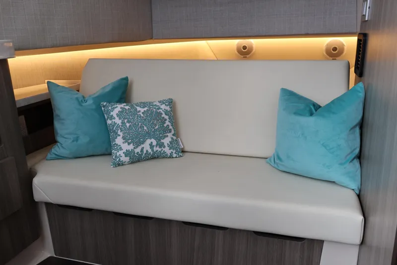  Yacht Photos Pics Interior of 2022 Regal 38 SAV yacht with elegant seating and decorative pillows.