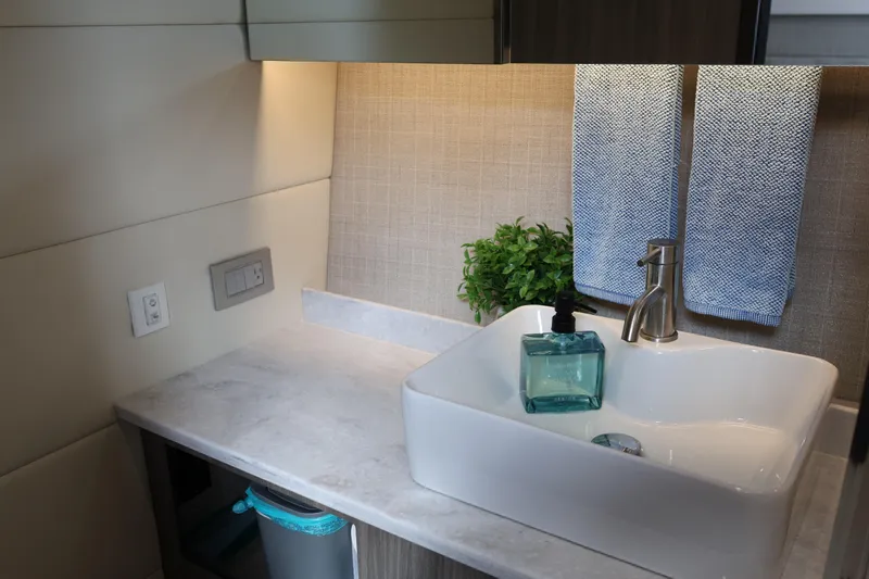  Yacht Photos Pics Modern bathroom sink in 2022 Regal 38 SAV boat, featuring sleek design and accessories.