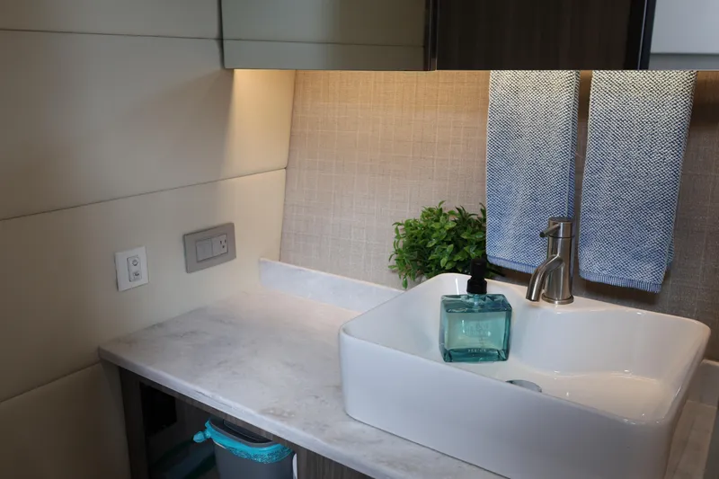  Yacht Photos Pics Modern bathroom sink in 2022 Regal 38 SAV yacht, featuring elegant design and accessories.